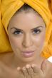 beautiful model in towel giving flying kiss