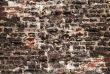 very rough wall with stones