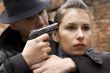 man threatens the woman with a pistol