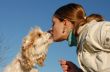 kissing woman and dog