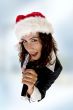 lady wearing christmas hat and singing