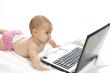cute baby playing with laptop