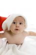 cute baby lying with santa cap
