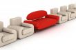 Row armchairs and red sofa on a white background. 3D image.
