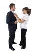 woman holding tie of man