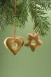 Christmas cookie hanging from fir branch