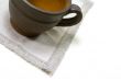empty coffee cup and linen napkin