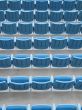 blue aligned plastic chairs