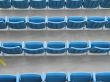 blue aligned plastic chairs