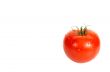 A tomato is in dew.