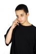 teenage boy in a serious conversation on his mobile