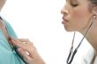 lady doctor examining the patient with stethoscope