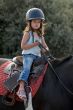 baby riding girl
