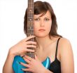 Young beautiful woman with guitar