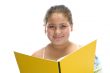 smiling girl with book looking you