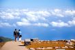 Couple going on road to blue sky in Madeira Island