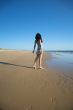 back dressed woman at the beach
