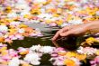 Woman touching flower petals