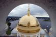 Gold domes of orthodox church with arch