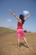 woman greeting a volcano