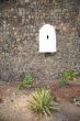 white sentry box and plants
