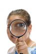 girl looking through magnifier