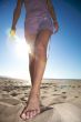 woman foot on the sand