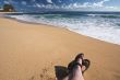 Man Relaxes on Tropical Shoreline