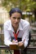 businesswoman with notebook outside