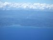 ocean and land viewed from a plane