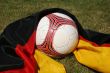 Soccer ball in front of the german flag