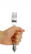 Man`s hand holding a fork