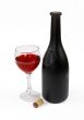 Red wine bottle, glass of wine and stopper