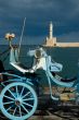 Blue traditional carriage with flowers and lighthouse