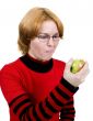 The girl eats an apple