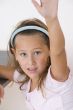 sweet little girl raising her hand