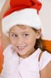 smiling little girl with christmas hat