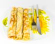 Pancakes in dish with sunflower