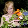 Girl with bunch of flowers