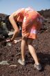 woman pick up stones