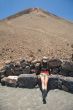 woman sitting down the volcano