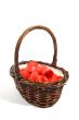 wicker basket filled with red rose peddles