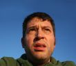 Man with a skeptical and anxious look
