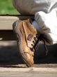 Child`s brown boot
