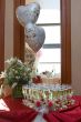 wedding table setting: Champagne, rose petals, balloons