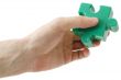 Puzzle piece in hand