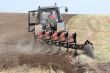 Machine harvesting the corn field