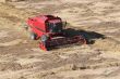 Machine harvesting the corn field