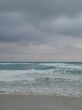 turquoise tropical ocean and dark sky