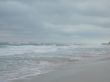 turquoise tropical ocean and dark sky